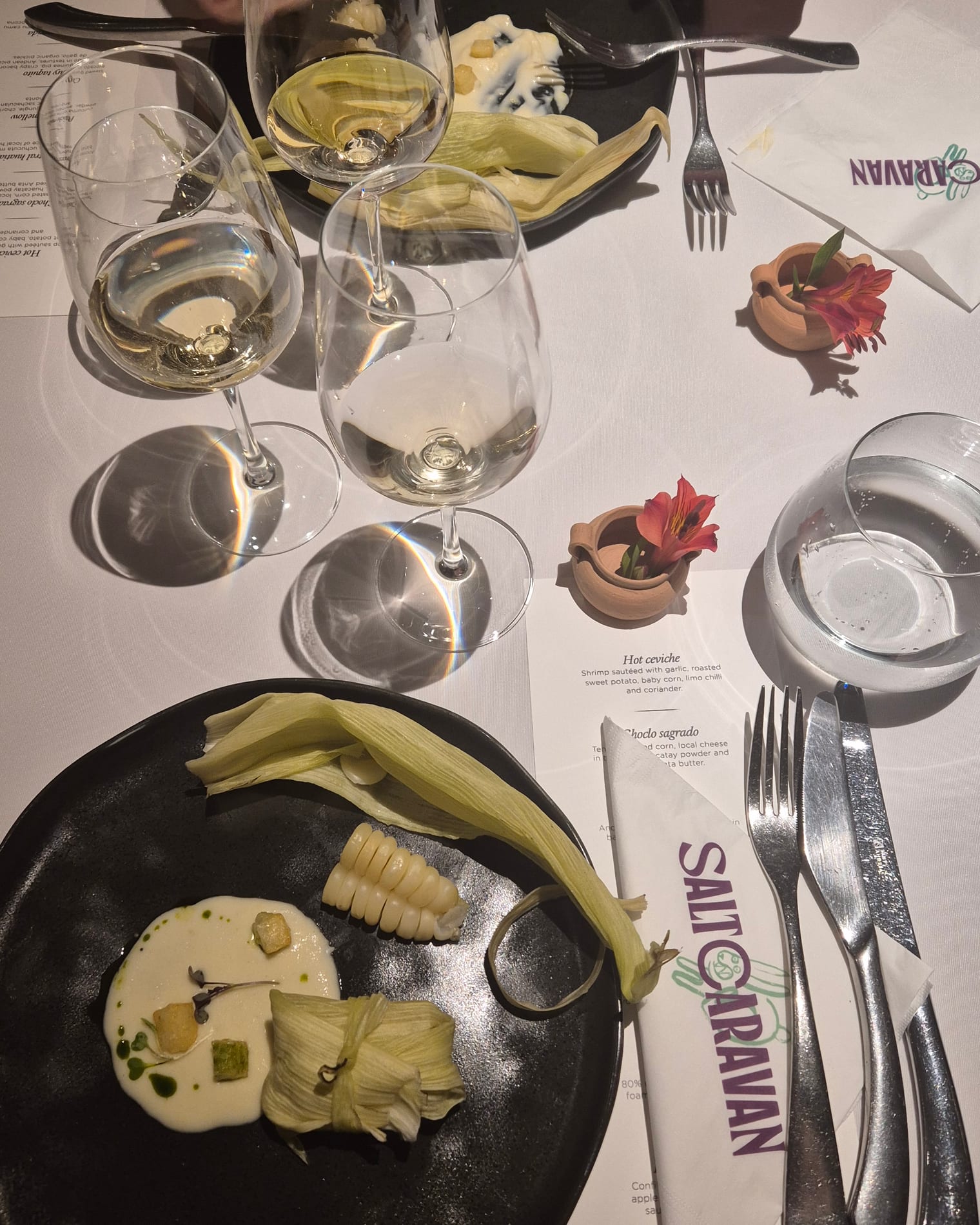The farewell dinner table, Salt Caravan menu laid out