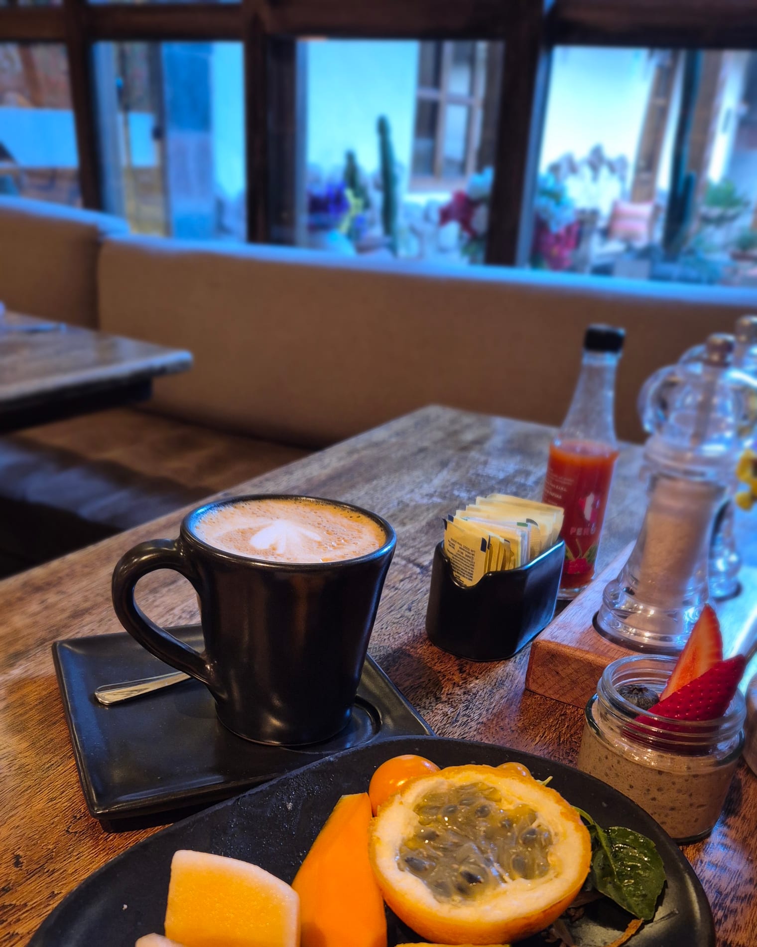 One last breakfast: fruit, coffee and a Cusco window